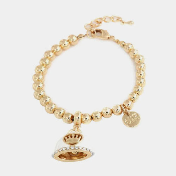 Bracciale in Metallo con campanella bianca e disegno centrale corona — collezione via camerelle